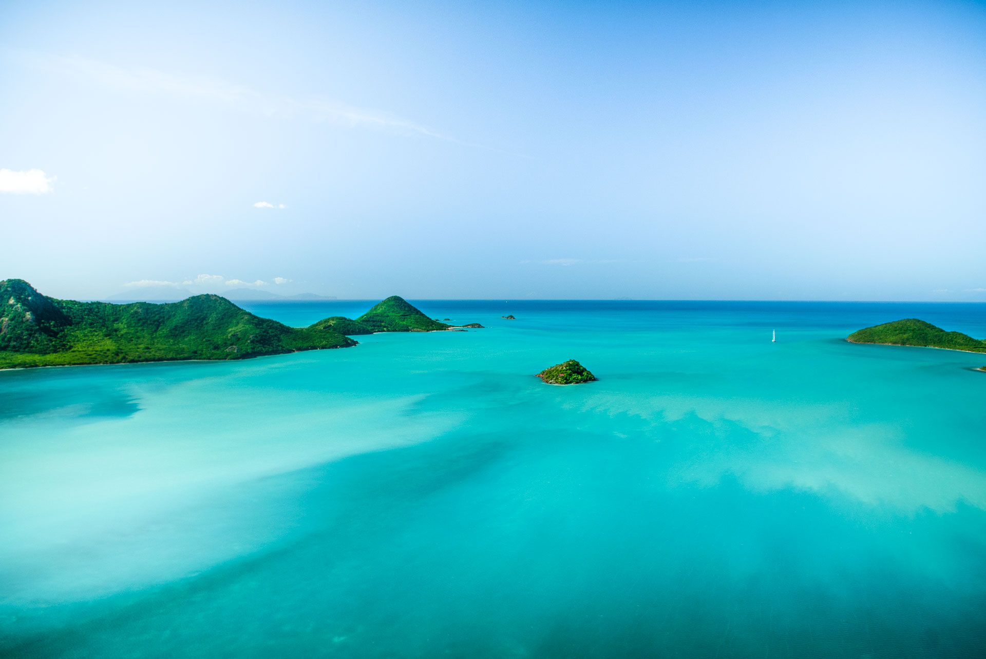 Moncada_Yachts_Leeward_Islands_slider2 Antigua food served on a yacht in view of the island on a sunny day.