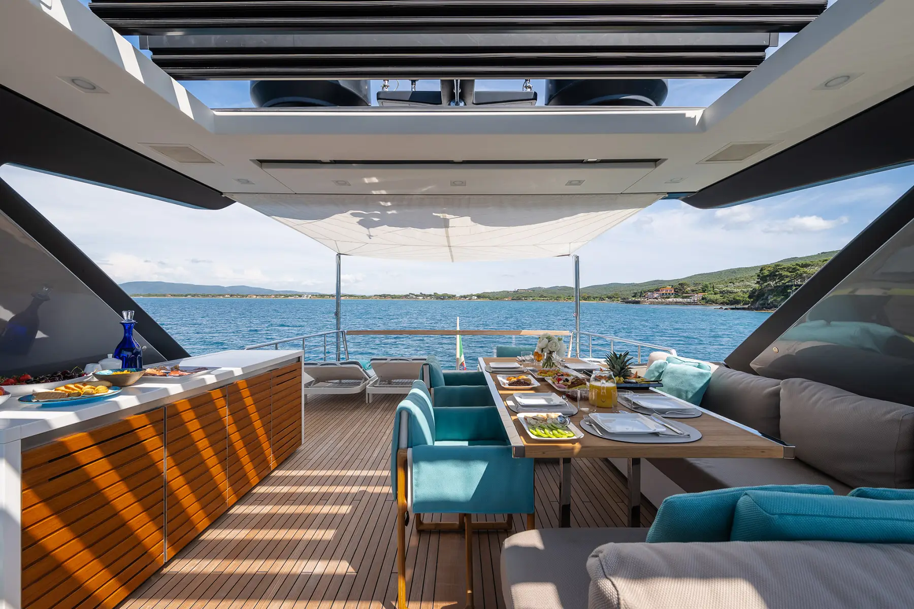The deck of the superyacht Pembe with furnishings and tables.
