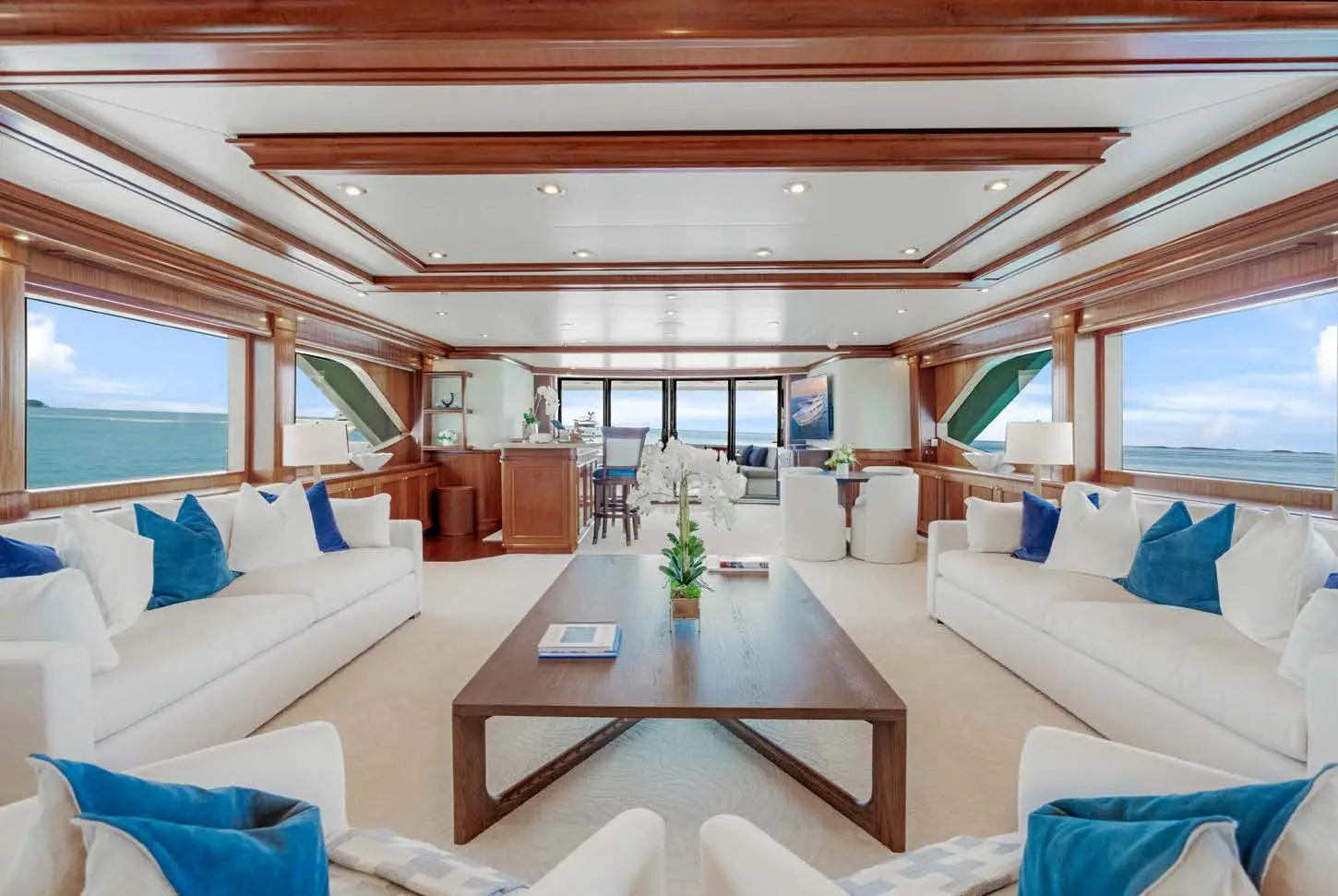 Interior salon of Miss Stephanie superyacht with sofas, cushions and centre table.