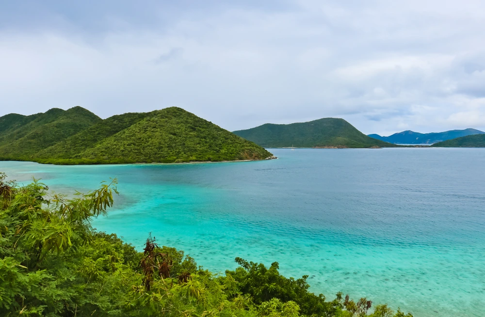 St John in the Virgin Islands. Bright blue waters between greenery.
