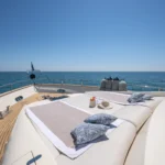 Exterior furnishings on the Girifalco V, with white and blue cushions.